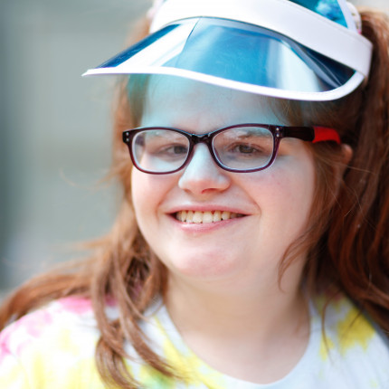 Young adult female, Clare, smiles at camera at Forward Vision