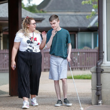 Ciaran, a young man who stays at Allermuir, uses a white cane - 400 pixel high