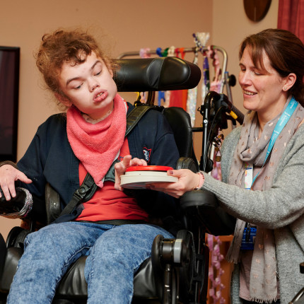 Amy, a Royal Blind School pupil, interacts with an instrument