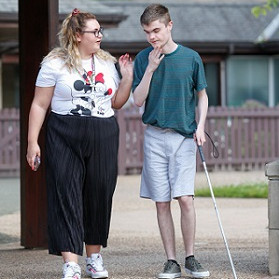 Ciaran, a young man who stays at Allermuir, uses a white cane