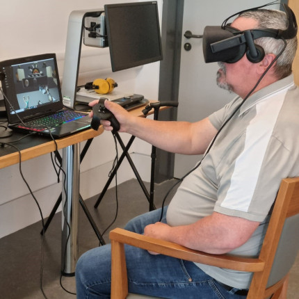 Veteran Derek Meechan wearing the VR kit in the Linburn's IT Suite