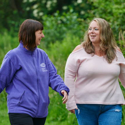 Debbie from Sight Scotland walks with Amanda who has a visual impairment and sight loss