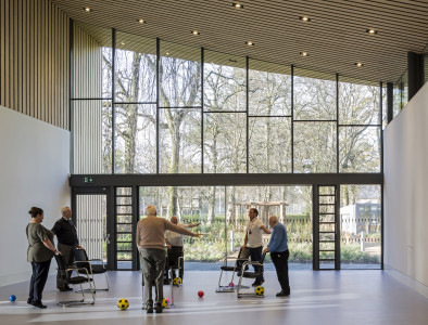 Veterans and staff participate in a strength and balance class in the Hawkhead Centre hall