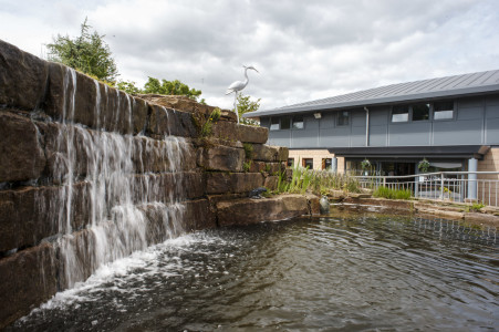 Braeside House care home for older people with visual impairments has a waterfall at the front entrance
