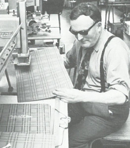 Veteran uses a machine in the workshop at Queen's Crescent