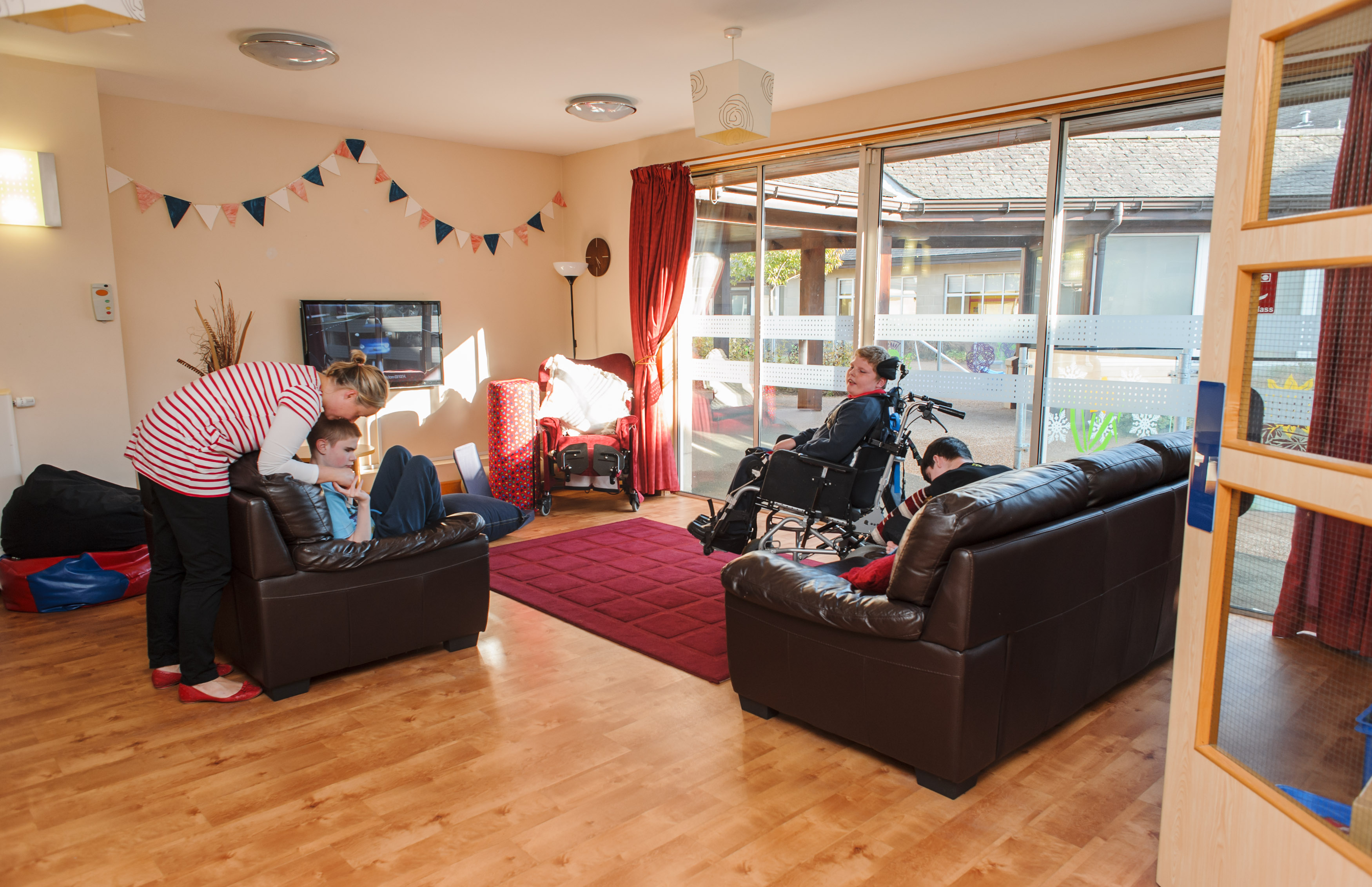 Pupils relax in living room