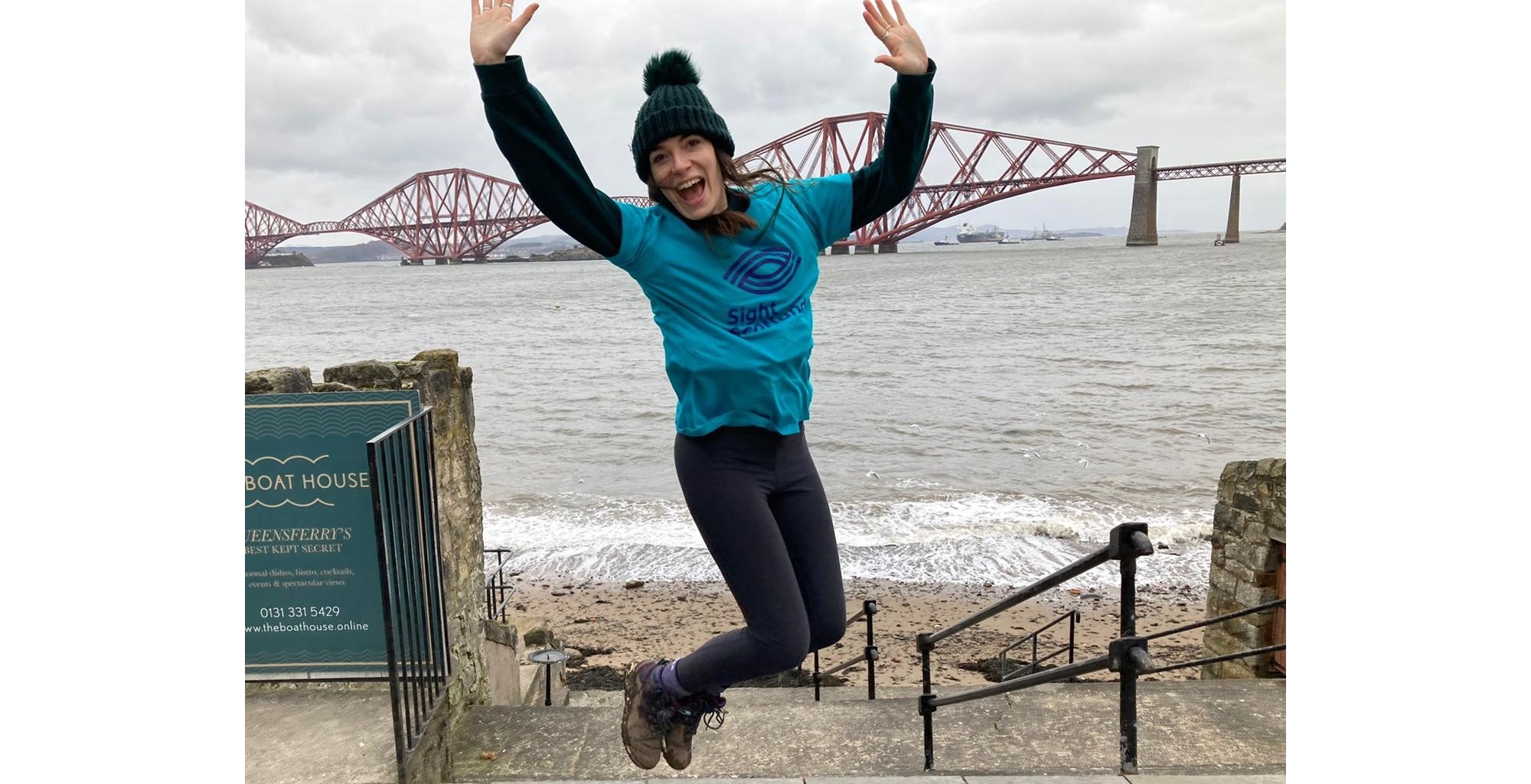 Kirsty celebrates reaching the Forth Rail Bridge, her fundraising challenge's final sight