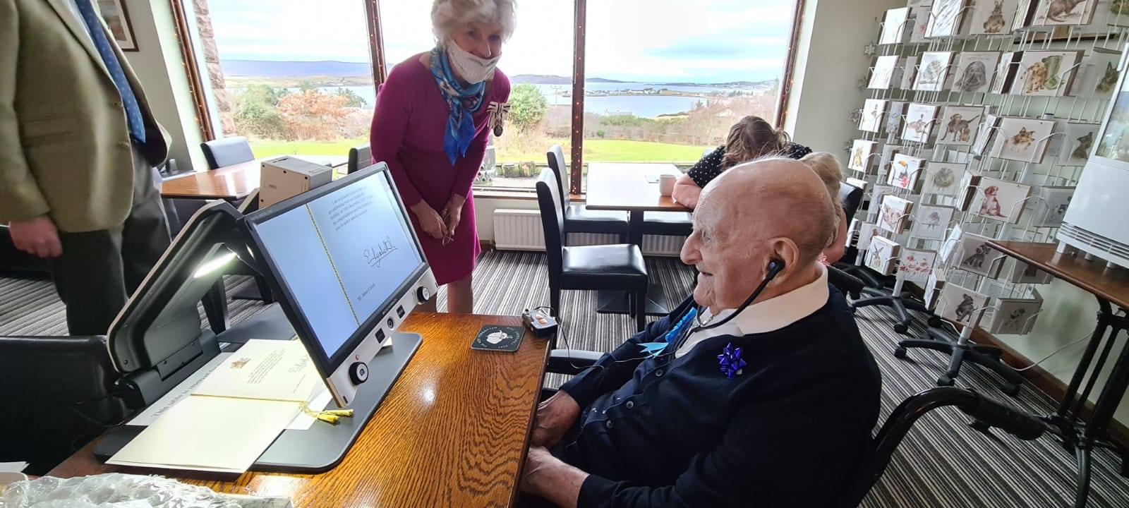 Veteran James Crook reads birthday cards with his video magnifier Veteran James Crook reads birthday cards with his video magnifier