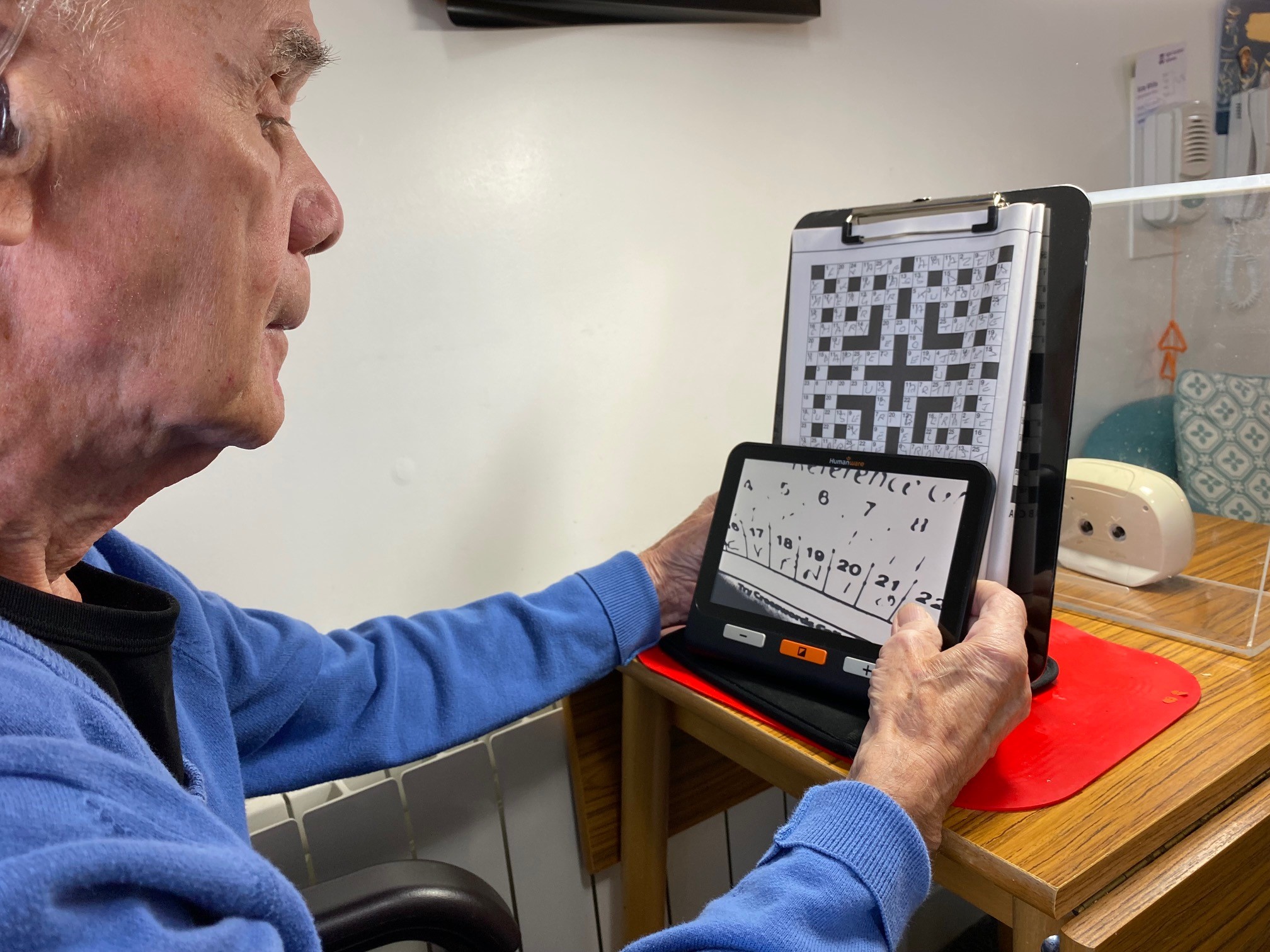 SSV veteran Henry Tyrell using electronic magnifier Veteran Henry Tyrell using electronic magnifier to read his Code Words puzzles