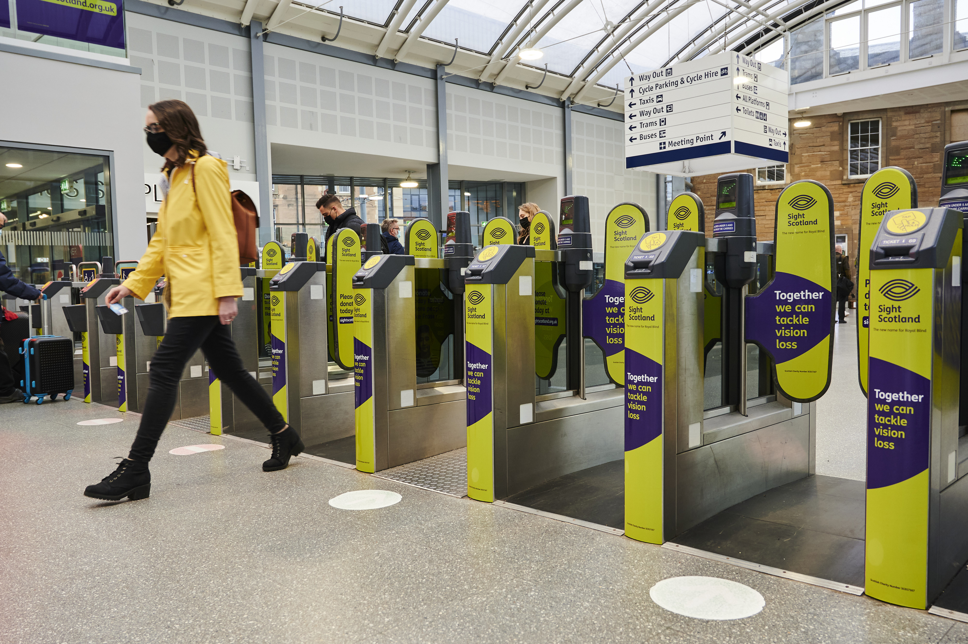 Sight scotland fair rail branding on railway station ticket barriers