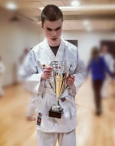 Ciaran with the Karate Student of the Month trophy he won