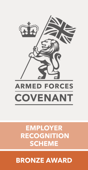 Armed Forces Covenant logo, which consists of a crown, next to a lion on hindlegs, holding a flag pole flying the union jack. 