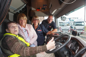 Charles (left) in HGV cabin with Carole, Wendy and Gary of David Murray Transport