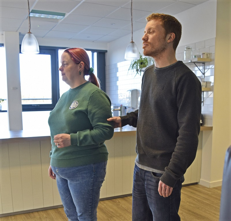 Marie being a sighted guide for Jamie, Stand beside and slightly ahead of the person being guided, close up