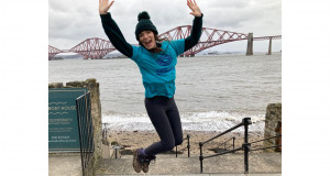 Kirsty celebrates reaching the Forth Rail Bridge, her fundraising challenge's final sight