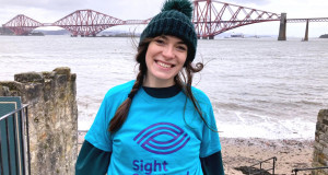 Kirsty celebrates reaching her fundraising challenges final sight, the Forth Road Bridge