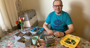 Fundraiser Stewart Lamb Cromar wears Lego t-shirt and builds with Lego