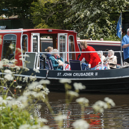 Residents enjoy a barge trip