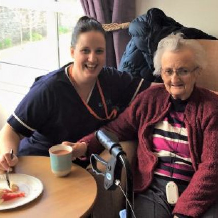 Landscape_Jenny's Well nurse Jasmine Giles takes tea with care home residen Mary Davidson300.jpg